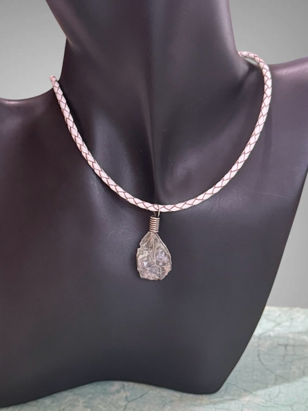 BRAIDED LEATHER AND CRYSTAL PENDANT NECKLACE